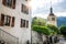 Bell tower of Saint Theodule church in Gruyeres medieval village at sunrise in La Gruyere Switzerland