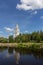 Bell tower stands near the river