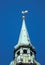 Bell tower steeple of St. Peter Church with weather vane `golden cockerel` in Riga, Latvia
