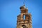 Bell tower with a storks nest in Plasencia old town.