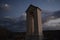 A bell tower under the moonlight