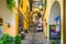 Bellagio borgo on Lake Como, Italy. Alley and stores.