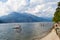 Bellagio, Italy - 13 August 2013: group of people dive from a trampoline in the lake of Como in Bellagio