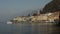 BELLAGIO, ITALY - CIRCA February 2017: a touristic boat reaches the pier of the village of Bellagio on the lake Como