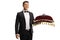 Bellboy holding a red velvet cushion with a call bell