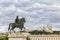 The Bellecour square in Lyon. Statue of Louis and Basilique Fourviere on a background. France