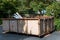 BELLEVUE, WA/USA â€“ SEPTEMBER 5, 2019: Residential yard with construction dumpster in driveway.