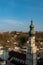 The bellfry of Burghausen with some old houses