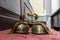 The bells used during Holy Mass lie on the church pew.