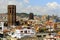 Belltower of cathedral, house and roof. Barcelona, Spain