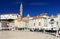 The belltower of St. George`s Church and The Franciscan monastery nearby, seen from the Tartini Square in Piran