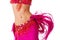 Belly dancer in a hot pink costume shaking her hips