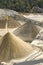 Belt conveyors and a piles of rubble and stone meal in Gravel Quarry