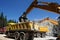 Belt excavator loading a big truck