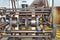 Belts and pulleys on machinery in an old cotton processing factory