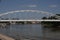 Belvarosi Hid bridge, also known as Downtown bridge on the tisza river during a sunny afternoon. The bridge connects the two parts