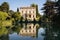 belvedere of italianate house over a calm lake
