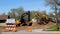 BEMIDJI, MN - 19 MAY 2020: ROAD CLOSED sign and yellow earth excavators.