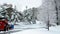 BEMIDJI, MN - 21 NOV 2019: Kubota SSV65 skid steer loader plowing new snow on a residential driveway