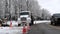 BEMIDJI, MN - 21 NOV 2019: Orange traffice warning cones at a work zone as a pickup drives past a parked utility truck on a city