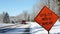 BEMIDJI, MN - 22 NOV 2019: UTILITY WORK AHEAD sign warns traffic about a work zone on a snowy city street, on a frosty and sunny