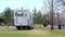 BEMIDJI, MN - 29 APR 2020: FedEx truck van delivering packages, backs up on residential street