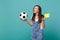 Bemused puzzled woman football fan support team with soccer ball, yellow card, propose player retire from field isolated