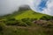 Ben Bulben, Republic of Ireland on a partly sunny day with rhododendron in the foreground