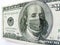 Ben Franklin wears a protect Healthcare Mask on a One Hundred Dollar Bill Illustrates the many costs of the Coronavirus outbreak