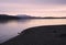 Ben Lomond at Loch Lomond during pink sunrise sky in Scotland