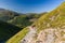 BEN NEVIS, SCOTLAND - SEPTEMBER 01 2021: Hikers making their way up the main track towards the summit of Ben Nevis on a hot, clear