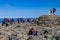 BEN NEVIS, SCOTLAND - SEPTEMBER 01 2021: Hikers on the summer of Ben Nevis on a hot, clear day. Ben Nevis is the tallest peak in