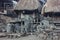 Bena village - traditional Indonesian village in Flores island with megalithic stone formations, grave yard and traditional houses