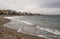 Benalmadena beach on a cloudy day in spain with buildings in the background