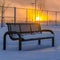 Bench against sunset on a winter day in Utah