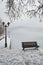 Bench on the banks of frozen lake Orestiada in Kastoria