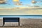 Bench on the beach of Alicante at sunset