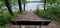 Bench on the cave trail overlooking twin valley lake in governor dodge state park in wisconsin