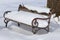 Bench covered in snow