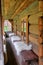 Bench with draped skins of sheep in front of the entrance to the traditional rural dwelling of Hutsul