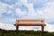 Bench in front of a pretty blue sky