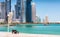 A bench in front of the Skyline of Doha