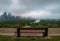 Bench Looking Out Over A Cloudy Downtown Calgary