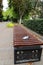 Bench with medical face mask in deserted park