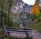 Bench near autumn evening Alps mountain lake with clear transparent water and reflections. Almsee lake, Upper Austria