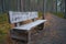 Bench next to the gravel trail in Komio Nature Reserve