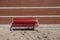 Bench on old town alley over wall background