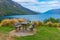 Bench overlooking Wakatipu lake in New Zealand