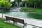 Bench in the park overlooking the fountain.