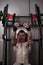 Bench press. Handsome bodybuilder workout on trainer in the gym